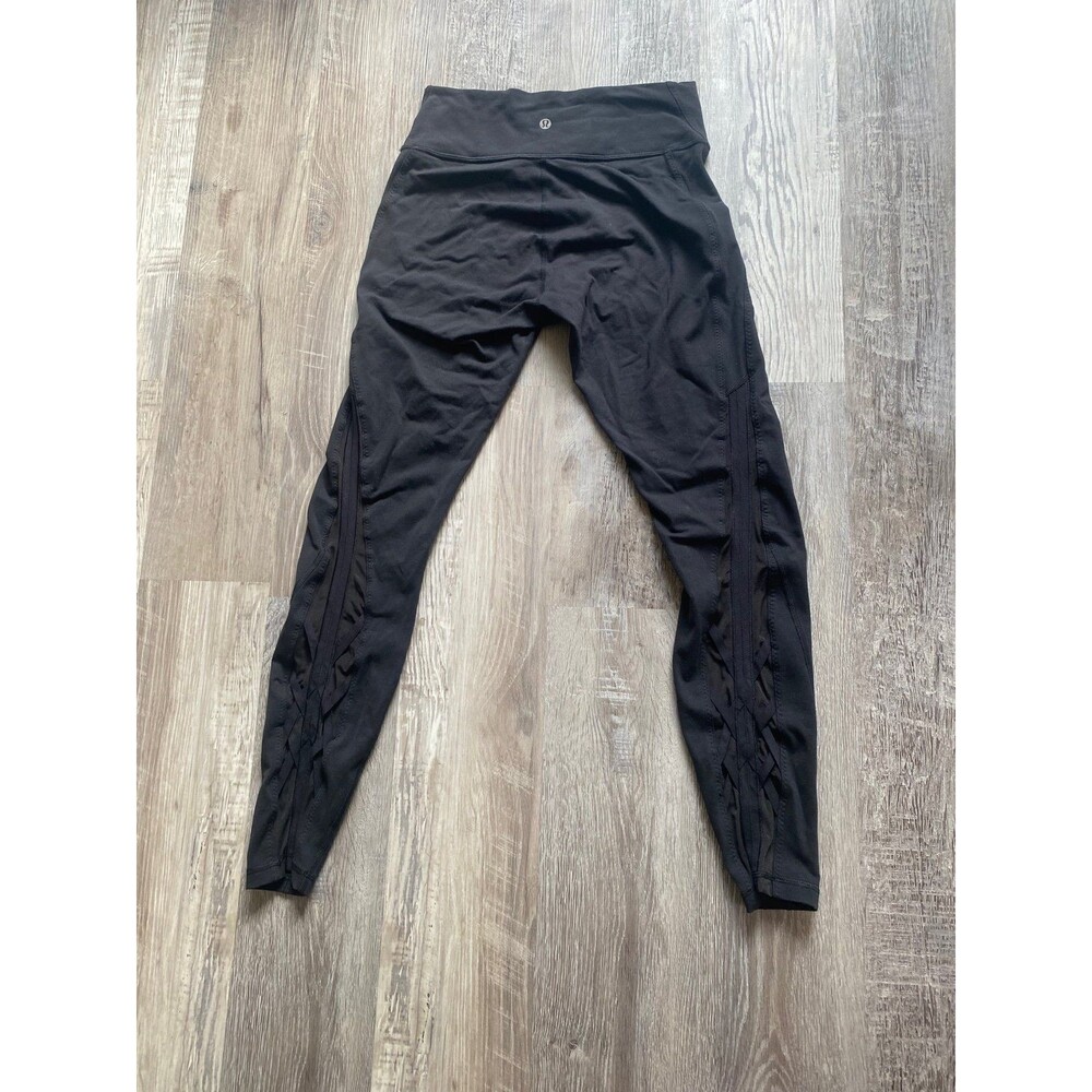 Lululemon black leggings with mesh criss cross details